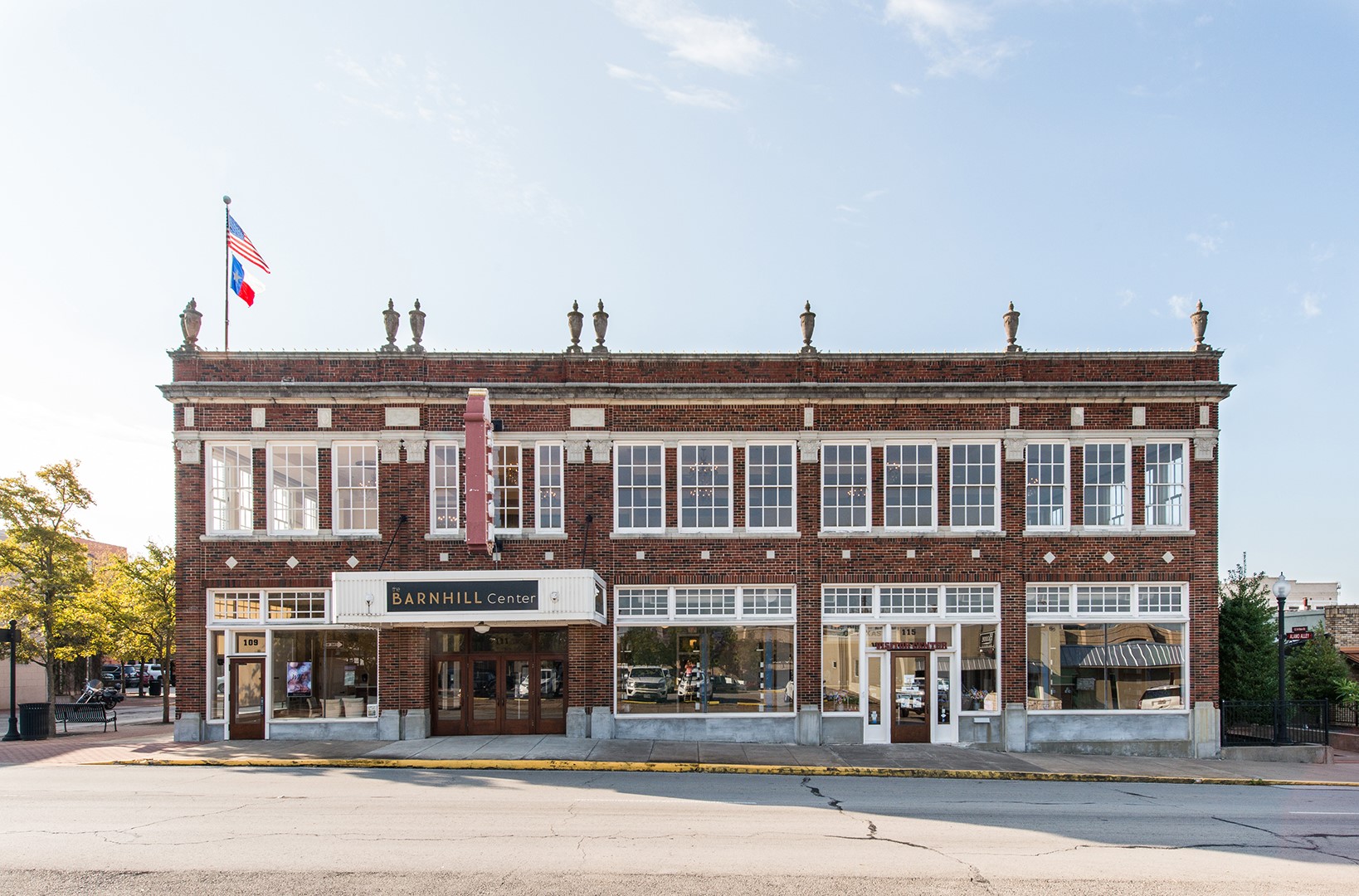 Picture of the front of the Barnhill Center. Two story brick building with large full pane windows on the first floor and individual window panes on the second floor.